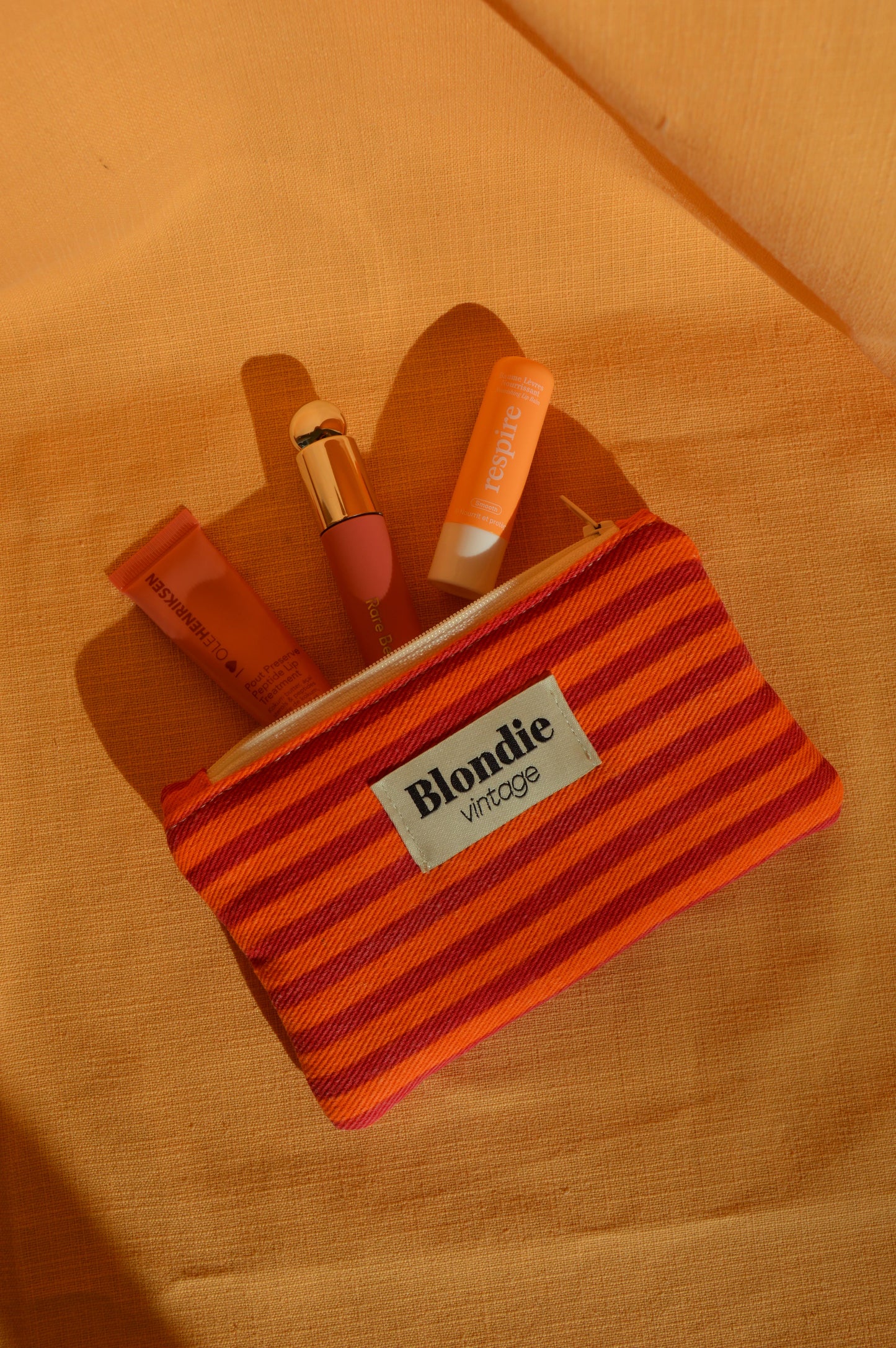 Mini pochette à rayures orange